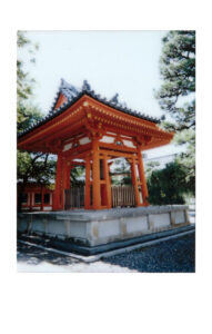 Polaroid of a small red temple in Japan